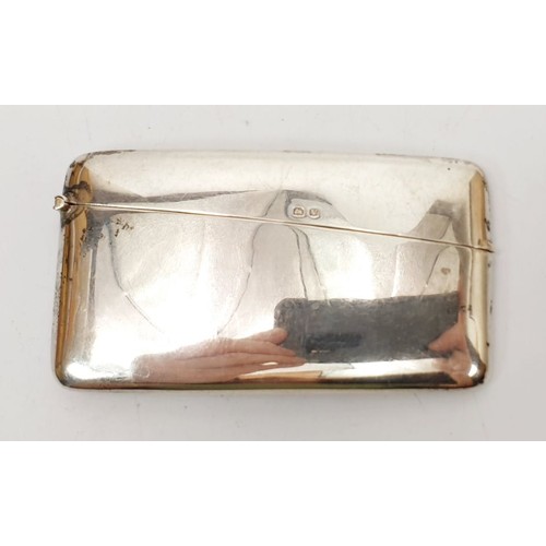 38A - A hallmarked silver card case, length 3.5