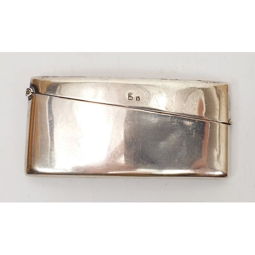 38B - A hallmarked silver card case, length 3.25