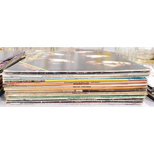 137 - Twenty three vinyl LPs including The Rolling Stones and Queen. UK shipping £14.