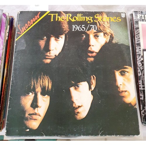 137 - Twenty three vinyl LPs including The Rolling Stones and Queen. UK shipping £14.