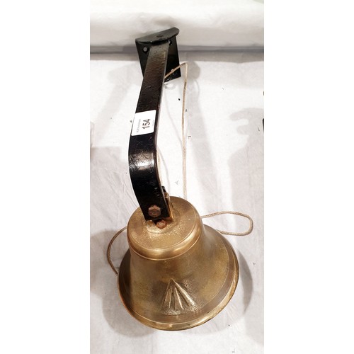 154 - A vintage brass military issue bell with wall mount and broad arrow mark, bell diameter 5.75