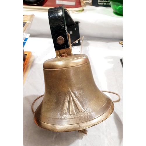 154 - A vintage brass military issue bell with wall mount and broad arrow mark, bell diameter 5.75