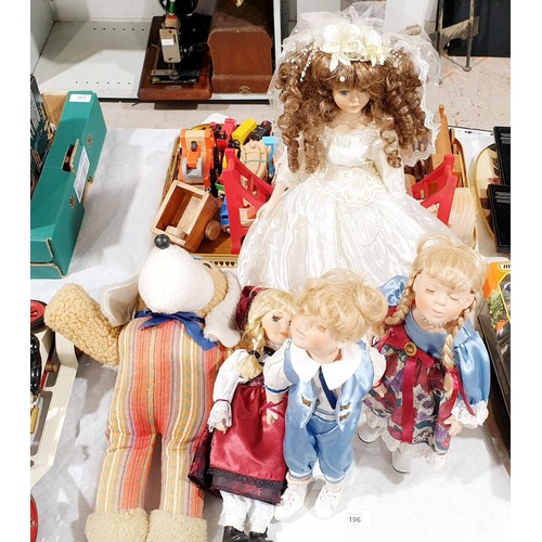 196 - A vintage soft toy and four collector's dolls. UK shipping £14.