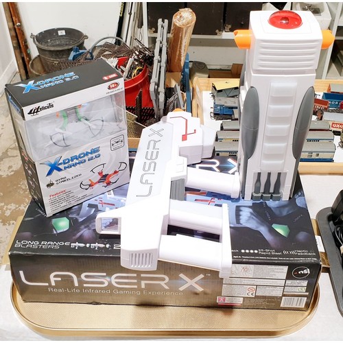 202 - A laser game and a boxed X Drone Nano. UK shipping £14. Electricals are sold as scrap.