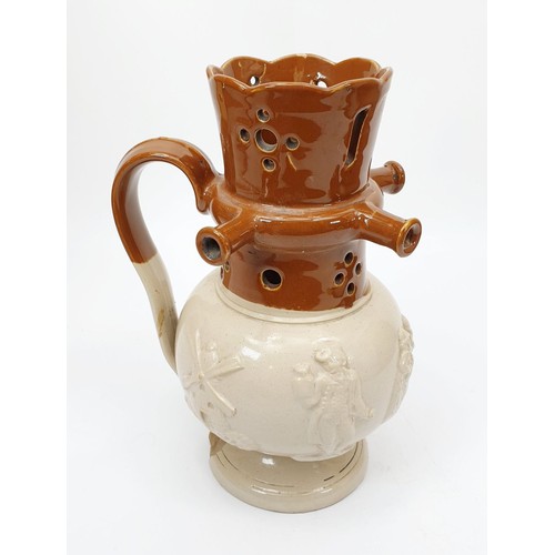 218 - A Victorian earthenware puzzle jug with relief motifs of figures a windmill and foliage, A/F, height... 