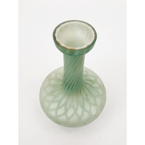 225 - An antique opaque glass vase with a twisted colour forming into a lattice pattern, height 6