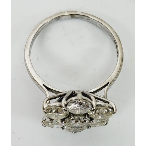 10 - A hallmarked 18ct white gold diamond cluster ring, approximately 3 to 3.5ct, size M, gross weight 3.... 