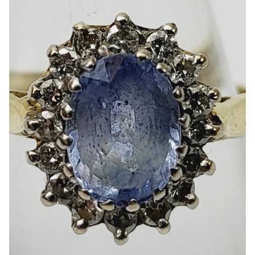 12 - A hallmarked 18ct gold Ceylon sapphire and diamond cluster ring A/F, size M/N, gross weight 4.2g. UK... 