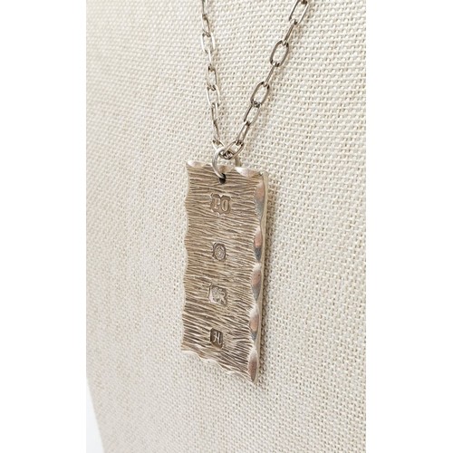 3 - A hallmarked silver ingot pendant on a silver chain, weight 26g, Sheffield 1982. UK shipping £14.