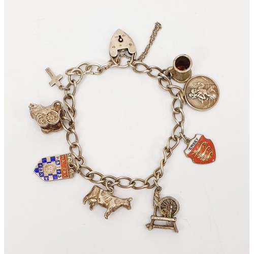 4 - A hallmarked silver charm bracelet, gross weight 27g. UK shipping £14.