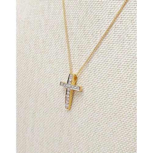 8 - An 18ct diamond set cross on a 9ct gold chain, chain length 16