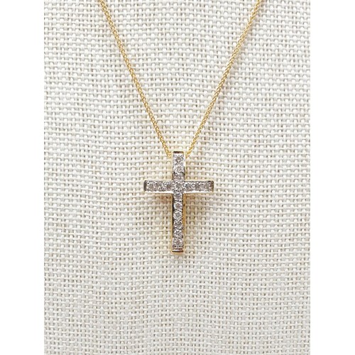 8 - An 18ct diamond set cross on a 9ct gold chain, chain length 16