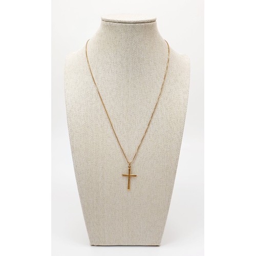 9 - A hallmarked 9ct gold cross on a 9ct gold chain, chain length 18