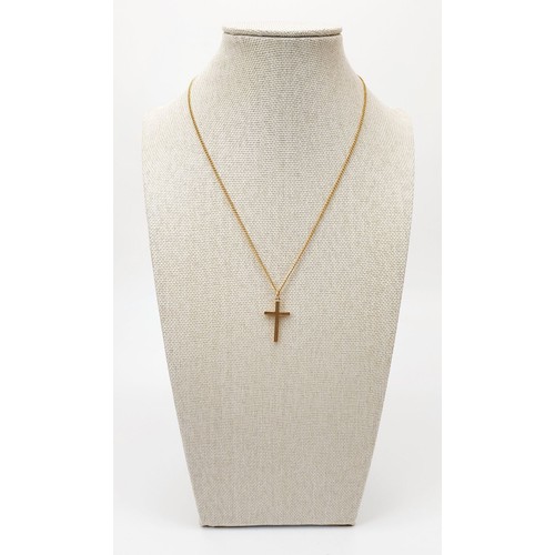 10 - A Chester hallmarked 9ct gold cross on a 9ct gold chain, chain length 16