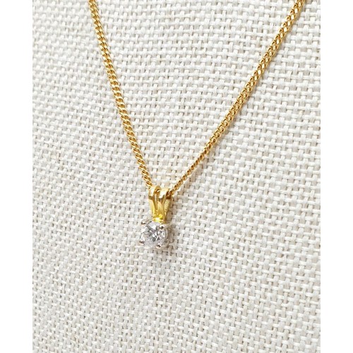 12 - A hallmarked 18ct yellow and white gold pendant set with a .33ct diamond on a hallmarked 18ct gold c... 