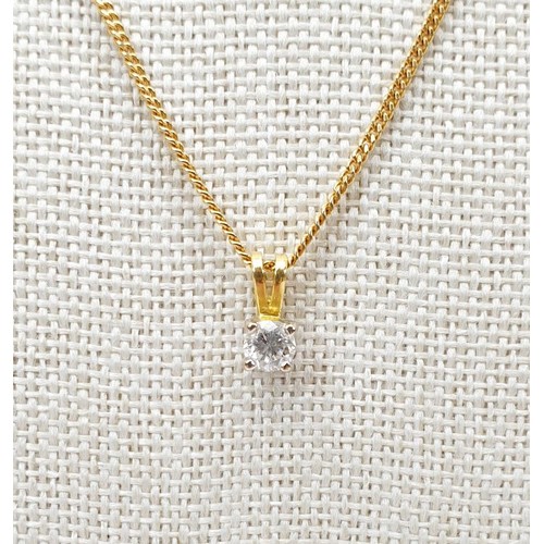 12 - A hallmarked 18ct yellow and white gold pendant set with a .33ct diamond on a hallmarked 18ct gold c... 