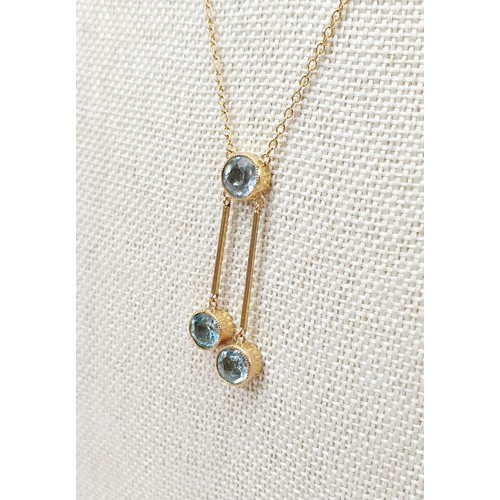 13 - A 1920s 9ct gold and aquamarine set pendant, chain length 17