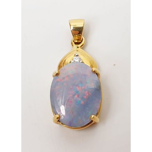 14 - A hallmarked 18ct gold pendant set with black opal and diamond, length 1.25