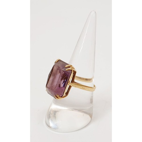 18 - A 9ct gold ring set with an amethyst, gross weight 5.3g, size P/Q. UK shipping £14.