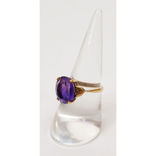 20 - A 9ct gold ring set with an amethyst, gross weight 2.9g, size O/P. UK shipping £14.