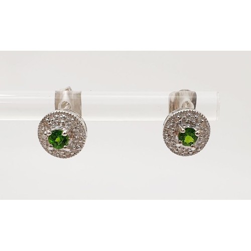 24 - A pair of hallmarked 18ct white gold earrings set with tsavorite and diamond, gross weight 1.8g. UK ... 