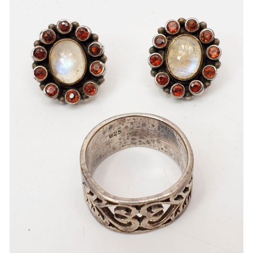 30 - A pair of silver earrings set with moonstones and garnets together with a silver ring, gross weight ... 