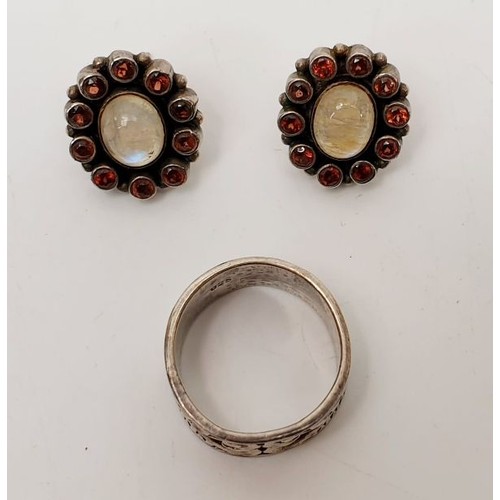 30 - A pair of silver earrings set with moonstones and garnets together with a silver ring, gross weight ... 