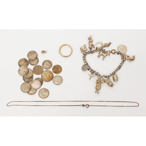 31 - A silver charm bracelet, a silver gilt ring, a silver chain and a selection of 3d silver content coi... 