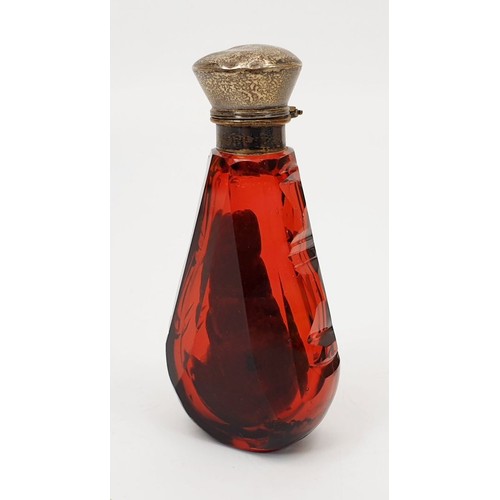 69 - An antique cranberry cut glass smelling salts bottle with stopper and silver plated lid, A/F, height... 