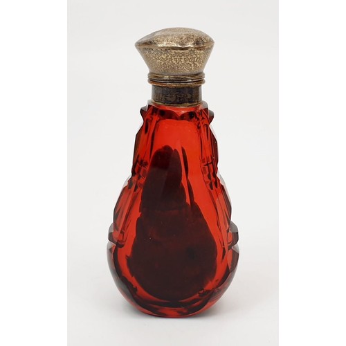 69 - An antique cranberry cut glass smelling salts bottle with stopper and silver plated lid, A/F, height... 