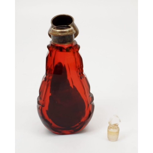 69 - An antique cranberry cut glass smelling salts bottle with stopper and silver plated lid, A/F, height... 