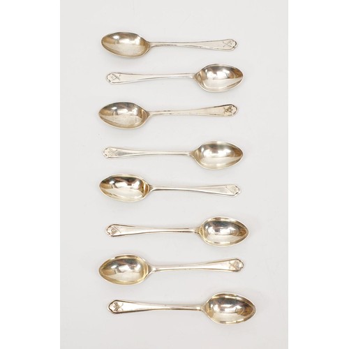 43 - A set of eight silver hallmarked spoons with a golf motif, weight 110g, maker's mark W&H, Sheffield ... 