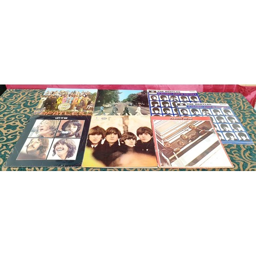 90 - Seven The Beatles albums including Abbey Road, Let it Be and Sergeant Pepper's with nine Beatles sin... 