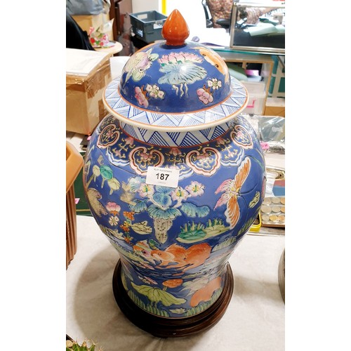 187 - A large Chinese Republic Period lidded jar decorated in poly chrome with goldfish, grasshoppers, but... 