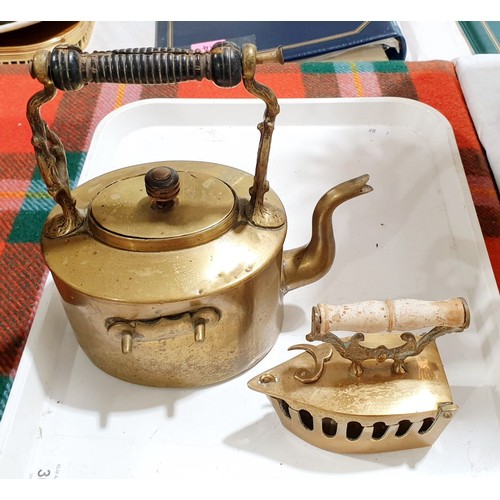 190 - An antique brass coal helmet together with a brass kettle and a brass box iron. No shipping. Arrange... 