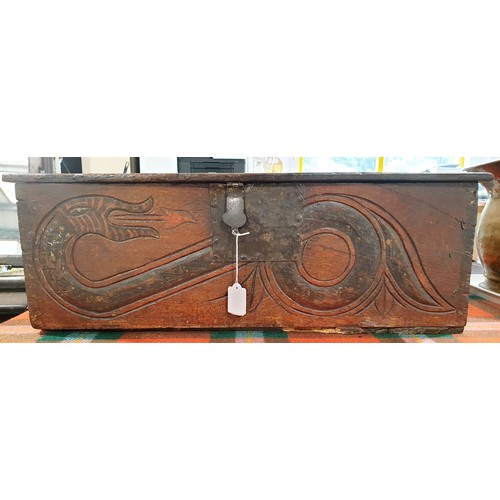 191 - An antique oak Bible box the front carved with a snake motif and having iron fittings A/F, 26