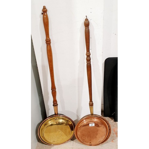 204 - Two copper and brass bed warming pans. No shipping. Arrange collection or your own packer and shippe... 