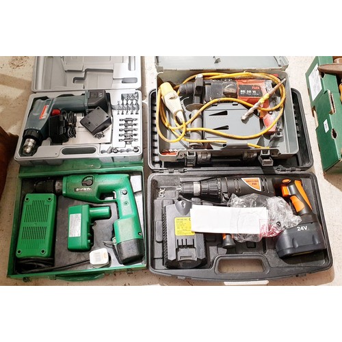 205 - Three cordless drills and 110v drill. No shipping. Arrange collection or your own packer and shipper... 