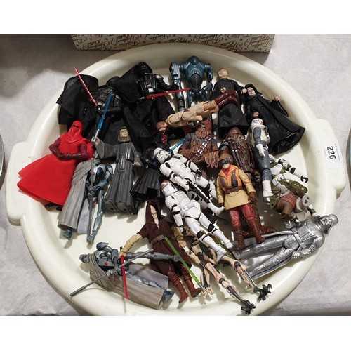 226 - Twenty two 1990s and 2000s Star Wars figures. UK shipping £14.