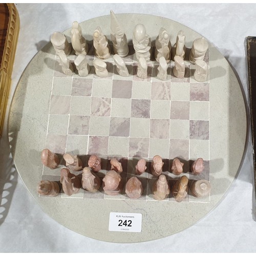 242 - A hard stone chess set, diameter 12