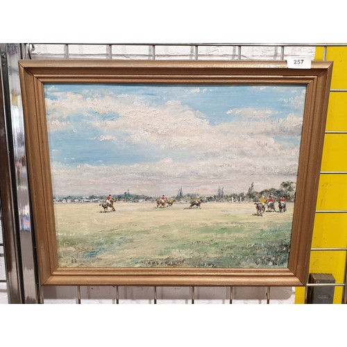 257 - An oil on board painting depicting a polo match, 14