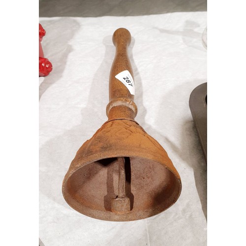 287 - An early 20th century cast iron and wooden hand bell, length 12