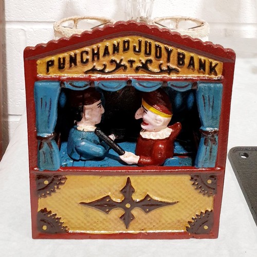 300 - A reproduction cast iron Punch and Judy moneybox, height 7