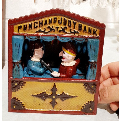 300 - A reproduction cast iron Punch and Judy moneybox, height 7