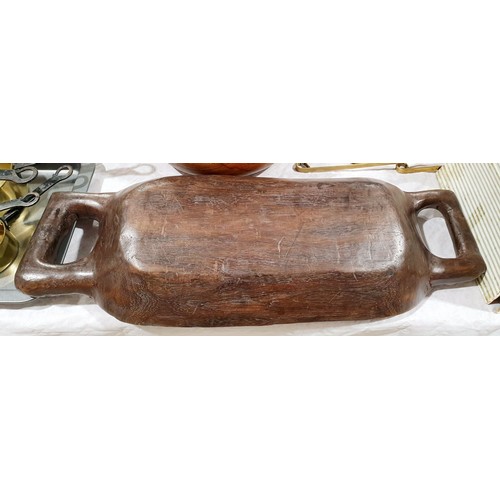 106 - Hand carved handled wooden bowl, length 21.5