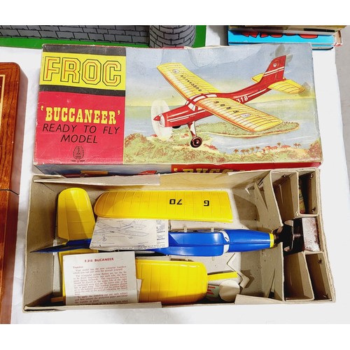 238 - A vintage boxed Froc Buccaneer rubber band powered plane together with a vintage boxed battery opera... 