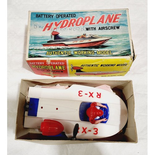 238 - A vintage boxed Froc Buccaneer rubber band powered plane together with a vintage boxed battery opera... 