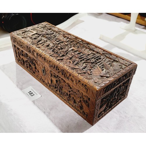 183 - A vintage Chinese wooden box intricately carved with figures in landscapes A/F, width 9.75