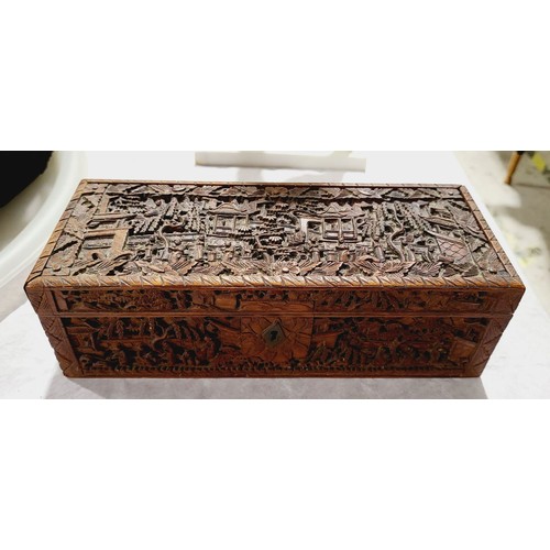 183 - A vintage Chinese wooden box intricately carved with figures in landscapes A/F, width 9.75