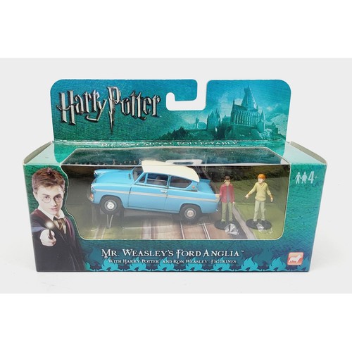 66 - A boxed Corgi Harry Potter Mr Weasley's Ford Anglia with Harry Potter and Ron Wheasley figurines. UK... 